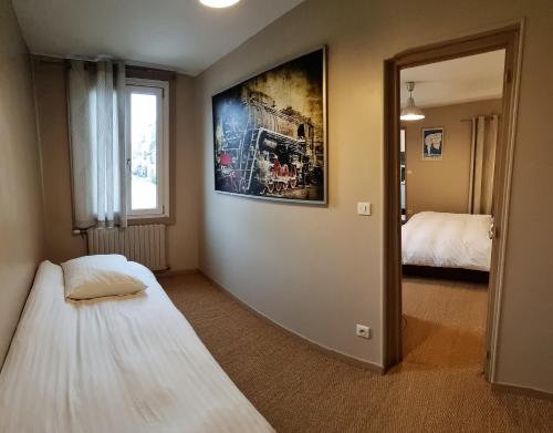 Ένα ή περισσότερα κρεβάτια σε δωμάτιο στο L'auberge Du Cochon D'or