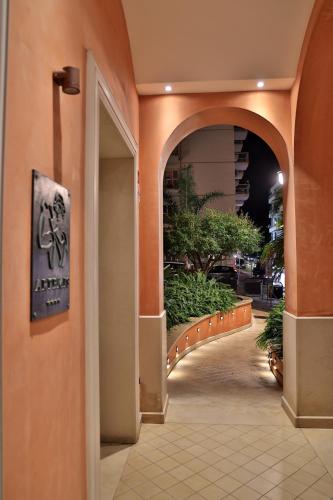 an entrance to a building with an archway at Artemis Hotel in Cefalù