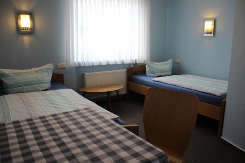 Katil atau katil-katil dalam bilik di Hotel Garni Pension Ruth