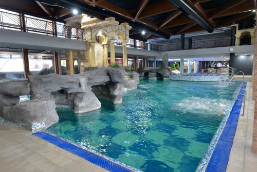 a pool in a hotel with a water slide at Spa Resort & Hotel Vrnjačke Terme in Vrnjačka Banja
