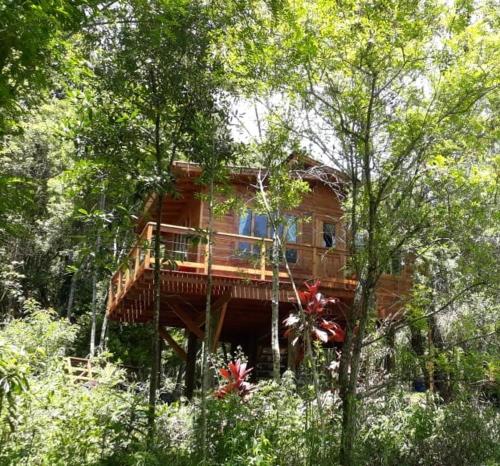 a tree house in the middle of the forest at Eco Aldeia in Nova Petrópolis