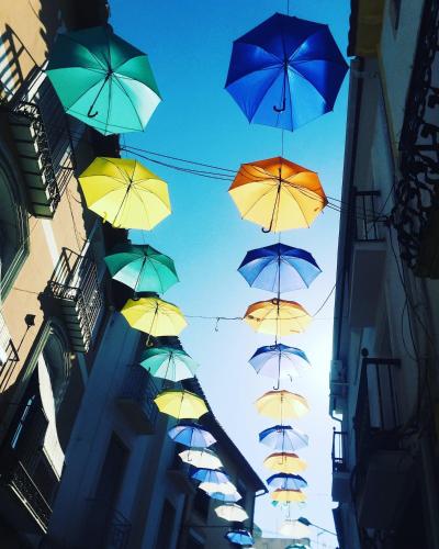 a bunch of umbrellas flying in the air at Cortijo Paraiso in Cúllar de Baza