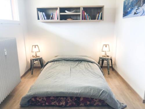 Ένα ή περισσότερα κρεβάτια σε δωμάτιο στο Résidence Altitude 1700