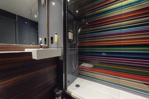 A bathroom at Village Hotel Manchester Cheadle