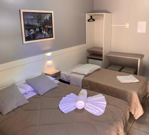Ein Bett oder Betten in einem Zimmer der Unterkunft Pousada Bello Outono