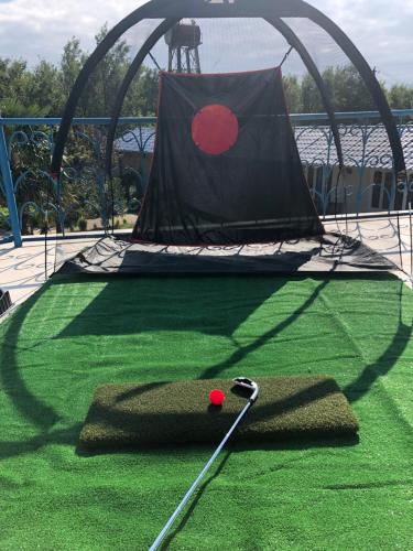 a miniature golf course with a golf ball on the grass at Europa Hotel-Kutaisi in Kutaisi