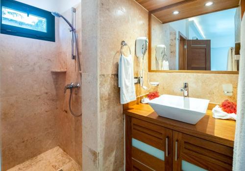 a bathroom with a sink and a shower at ALIGIO luxury apart-hotel in Las Terrenas