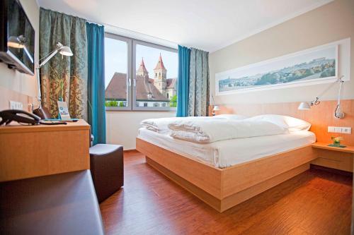 Postel nebo postele na pokoji v ubytování Sebcity Hotel