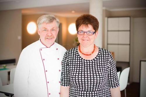 a man and a woman standing next to each other at Sebcity Hotel in Ellwangen