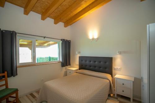 Cama ou camas em um quarto em Apartamentos Rurales Miramar