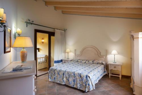 A bed or beds in a room at Il Giardino degli Oleandri