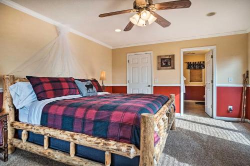 a bedroom with a bed and a ceiling fan at Hiawassee Cabin with Mtn Views Less Than 1 Mi to Lake! in Hiawassee