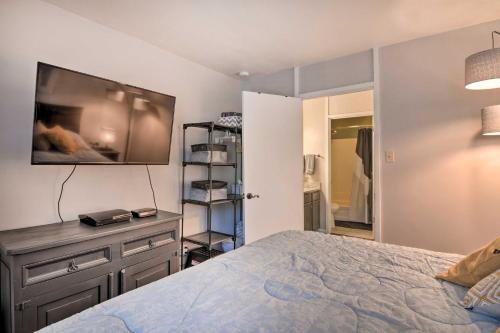 a bedroom with a bed and a tv on the wall at Sweet Skiers Escape Less Than Half-Mile to the Slopes! in Brian Head