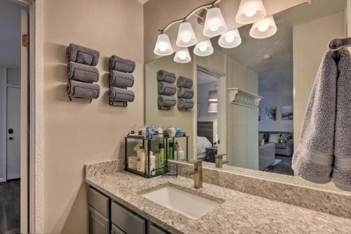 a bathroom with a sink and a large mirror at Sweet Skiers Escape Less Than Half-Mile to the Slopes! in Brian Head
