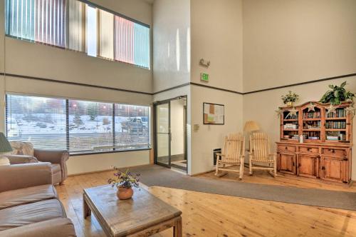 a living room with a couch and a table at Sweet Skiers Escape Less Than Half-Mile to the Slopes! in Brian Head