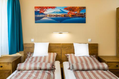 Ένα ή περισσότερα κρεβάτια σε δωμάτιο στο Öreghegyi Bika Panzio