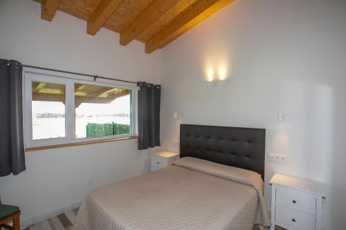 Postel nebo postele na pokoji v ubytování Apartamentos Rurales Miramar