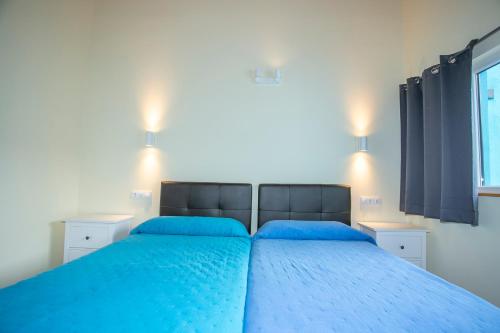 Postel nebo postele na pokoji v ubytování Apartamentos Rurales Miramar