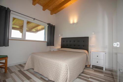 Postel nebo postele na pokoji v ubytování Apartamentos Rurales Miramar