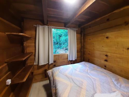 Ein Bett oder Betten in einem Zimmer der Unterkunft POUSADA CABANA TIO ZEZO