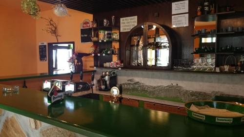 a bar with a sink and a counter top at Restaurace penzion Rafael in Dlouhá Brtnice