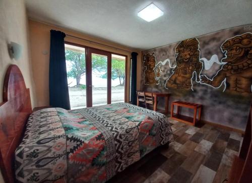 Postel nebo postele na pokoji v ubytování Xcalak Caribe Lodge
