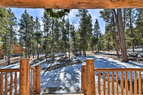 a winter view from the porch of a cabin at Remodeled Fairplay Log Cabin with Wood-Burning Sauna in Fairplay