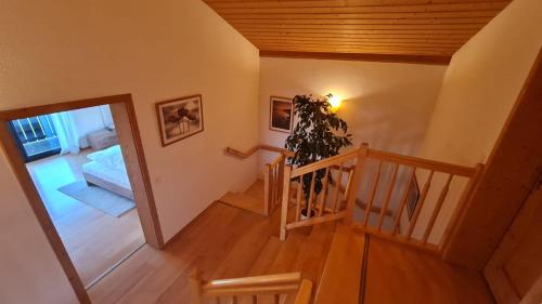 an overhead view of a room with a staircase and a bedroom at Schönes Ferienhaus am Herrenberg in Prien am Chiemsee