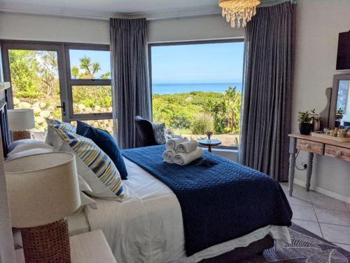 Ένα ή περισσότερα κρεβάτια σε δωμάτιο στο Villa Cape Garden Route