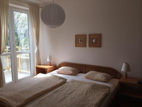 Katil atau katil-katil dalam bilik di Apartamenty przy Plaży