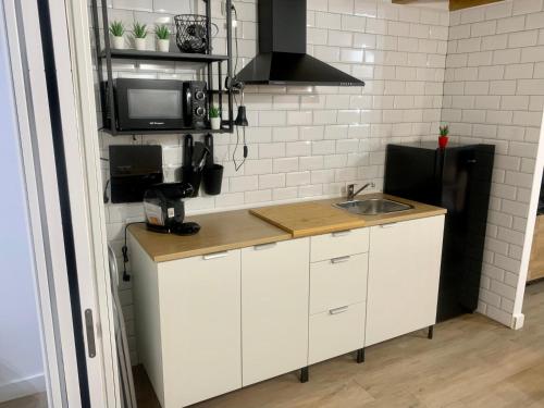 Kuchyň nebo kuchyňský kout v ubytování Puerta de Caceres Apartamento 3