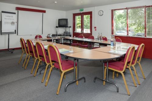 a conference room with a large table and chairs at Campanile Hotel - Basildon - East of London in Basildon