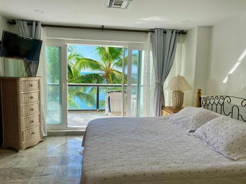 Krevet ili kreveti u jedinici u okviru objekta Exclusivos Apartamentos con playa privada
