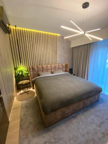 Кровать или кровати в номере Art'penthouse