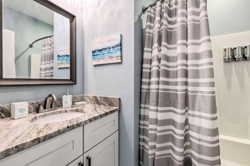 a bathroom with a sink and a shower curtain at Newly Built DAUPHIN ISLAND Home! in Dauphin Island