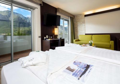 En eller flere senger på et rom på Best Western Hotel Adige