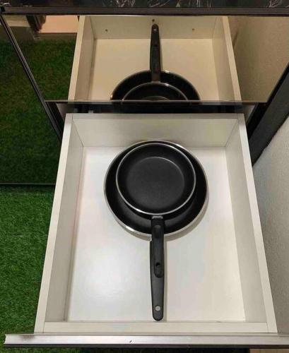 a black pot on top of a stove at Inap Kayangan @ Puncak Alam with Swimming Pool in Bandar Puncak Alam