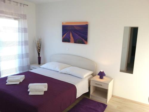 Postel nebo postele na pokoji v ubytování Apartments Levanat