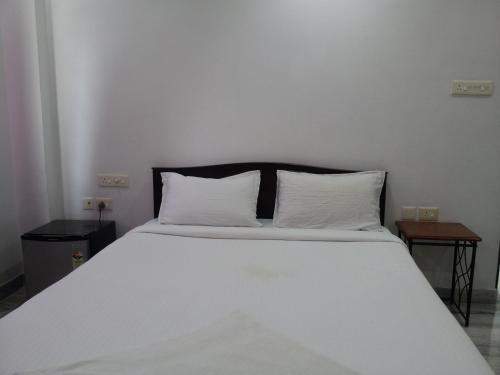 Cama o camas de una habitación en Roshini Serviced Apartments