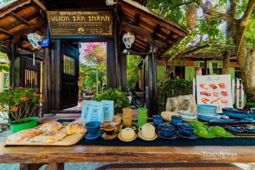 a table full of food on a table at Tan Thanh Garden Homestay in Hoi An