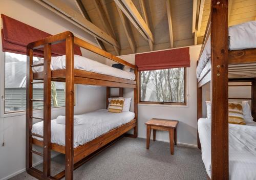 a bunk bed room with two bunk beds in a house at Absinthe in Dinner Plain