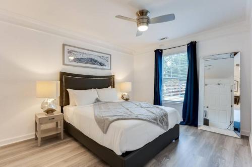 a white bedroom with a bed and a window at Luxury Atlanta Home - Self Check-in Pet Friendly Free Parking in Atlanta