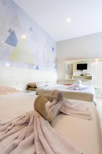 Una cama o camas en una habitación de Batuque Town Villa