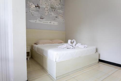 Una cama o camas en una habitación de Batuque Town Villa