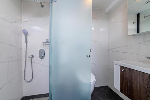a bathroom with a shower and a toilet and a sink at Septimum Hotel in Istanbul