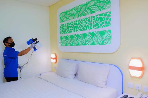 Postel nebo postele na pokoji v ubytování Cordex Hotel Ancol