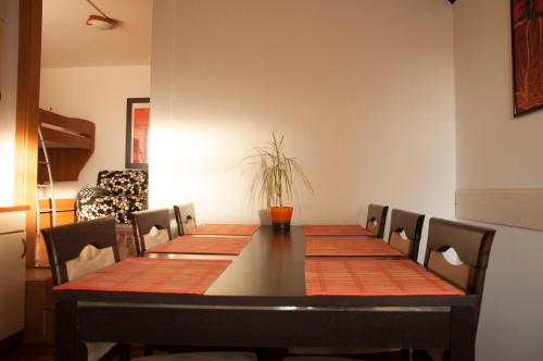 a dining room with a table and chairs at Apartment Beli Kriz in Piran