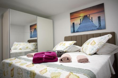 Postel nebo postele na pokoji v ubytování Pearl Apartment