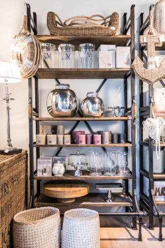 a shelf filled with pots and pans and baskets at BollAnts Spa im Park in Bad Sobernheim