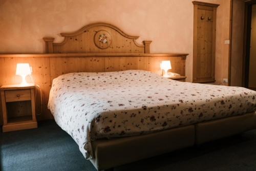 Ein Bett oder Betten in einem Zimmer der Unterkunft Hotel Primiero